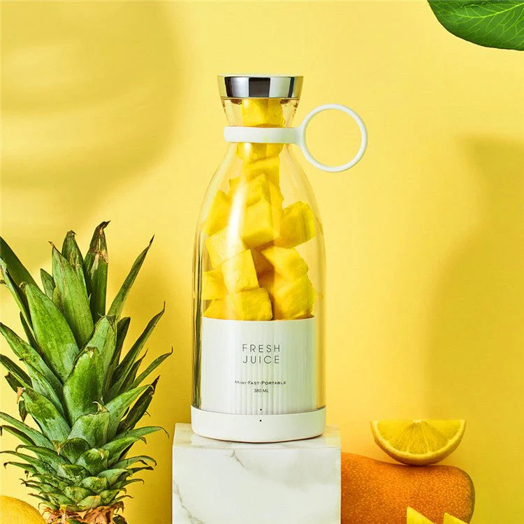 Clear bottle with pineapple pieces on a yellow background